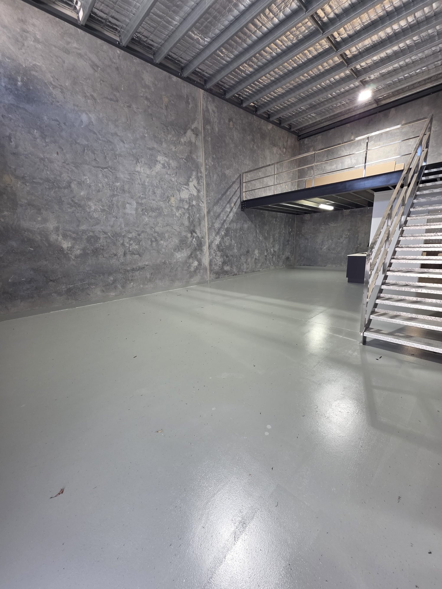 Mezzanine level and kitchenette in a completed Pacific Woods Estate unit — Townsend NSW industrial lease and sale